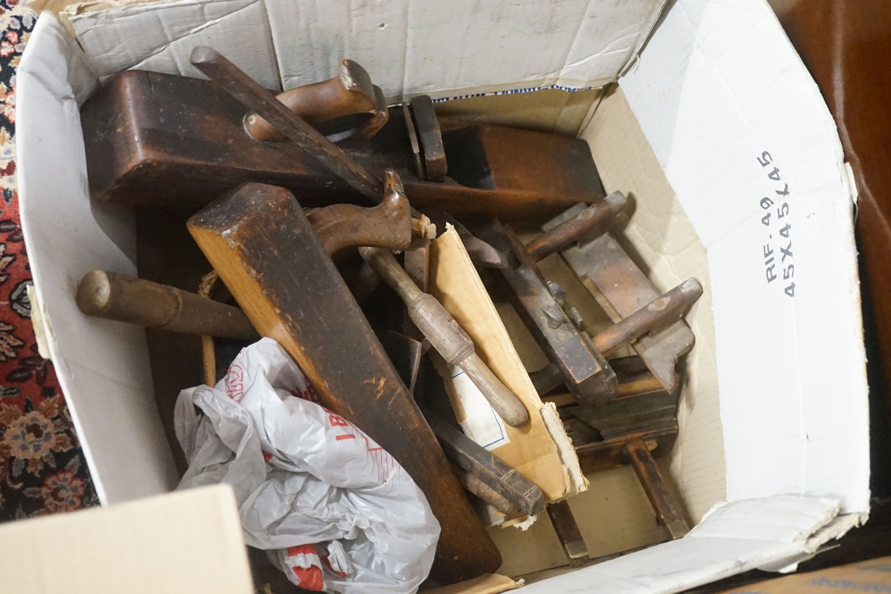 A large quantity of Victorian and later carpentry tools to include assorted steel and brass mounted planes, three Victorian pine trunks etc.